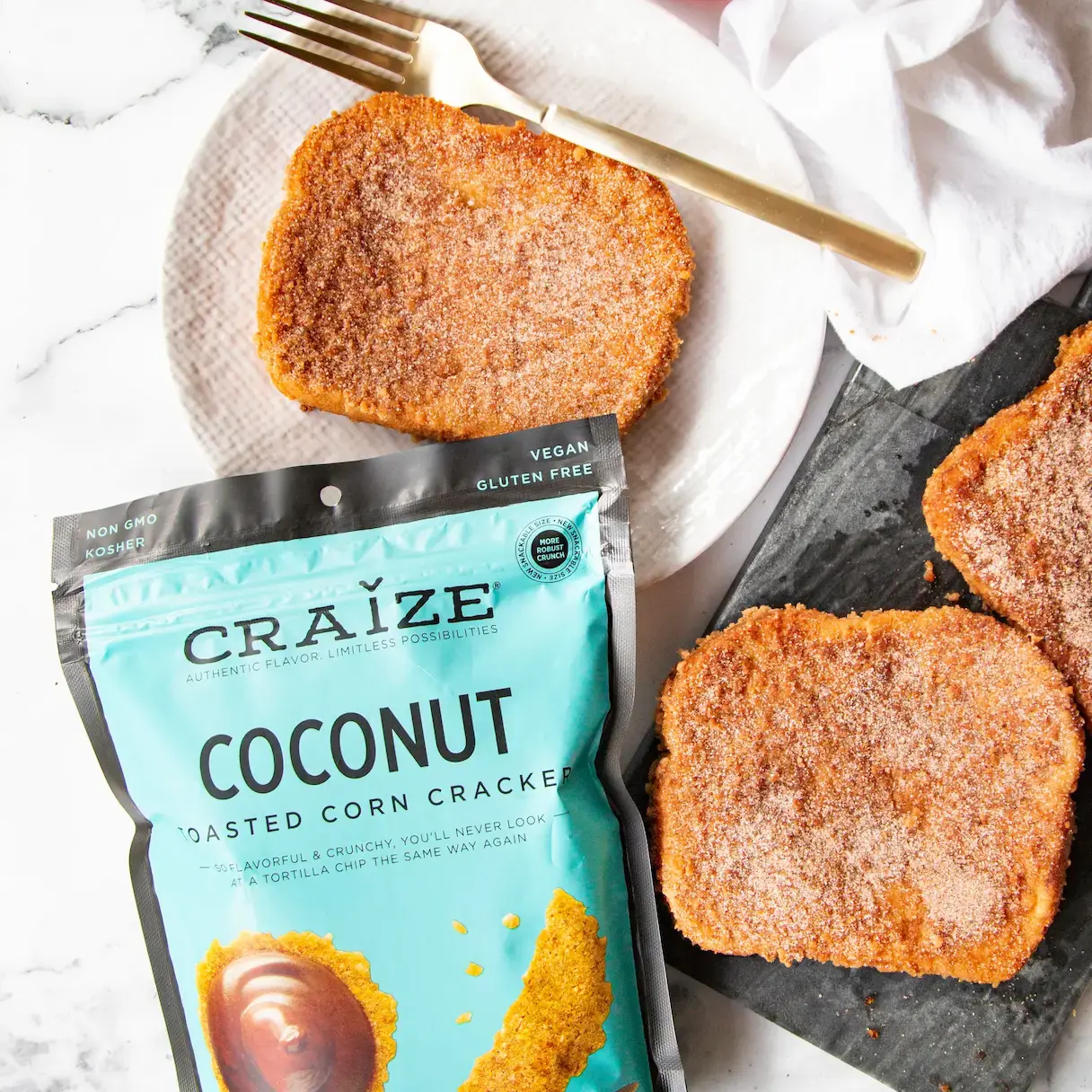 Craize Coconut crackers bag beside sugar-coated toast slices, honey, and a fork.