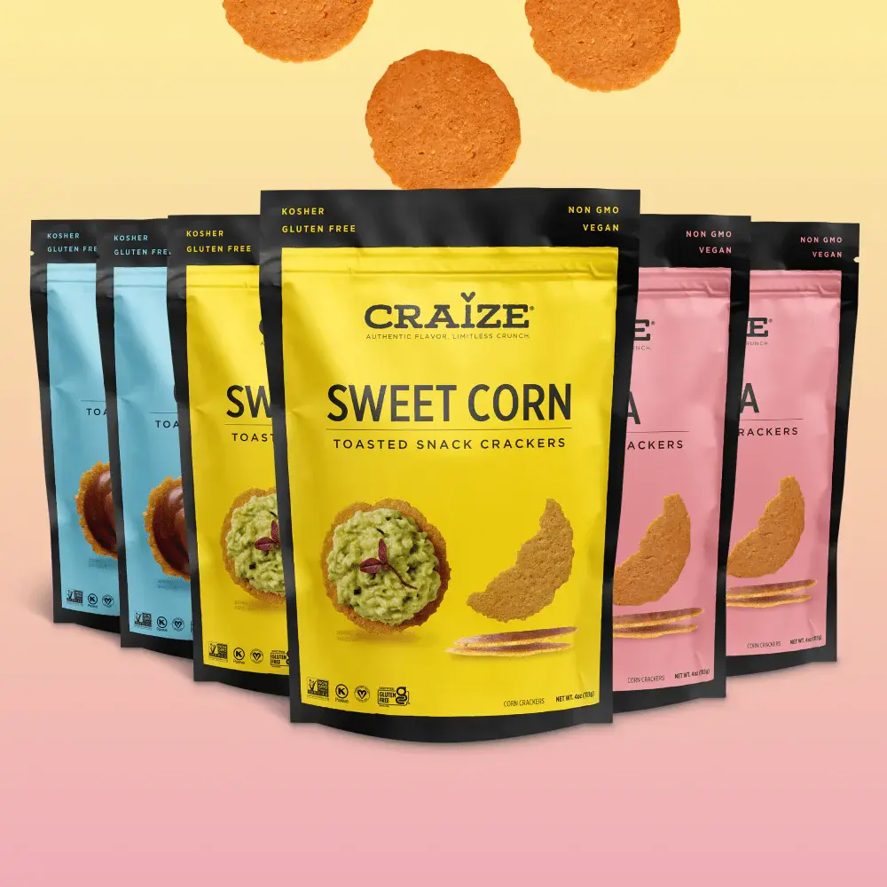 Craize Sweet Corn bag front with other flavours behind on a pink background.